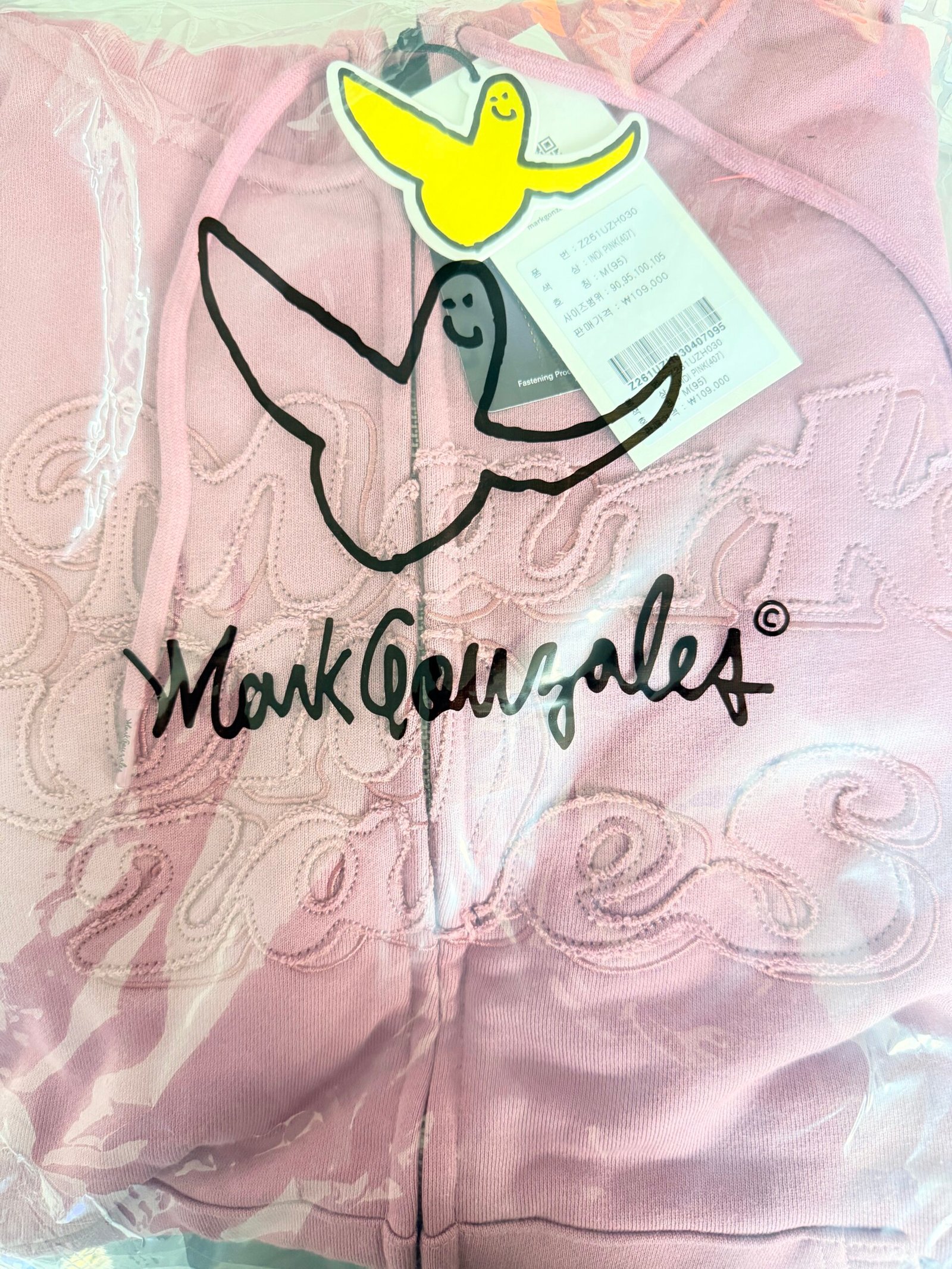 A Mark Gonzales Korea hoodie with Korean size and price tag handled during sourcing