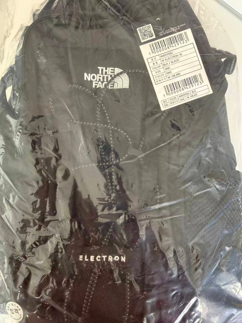 The North Face Korea W Electron 10 NM2DR53J black backpack with Korean hangtag