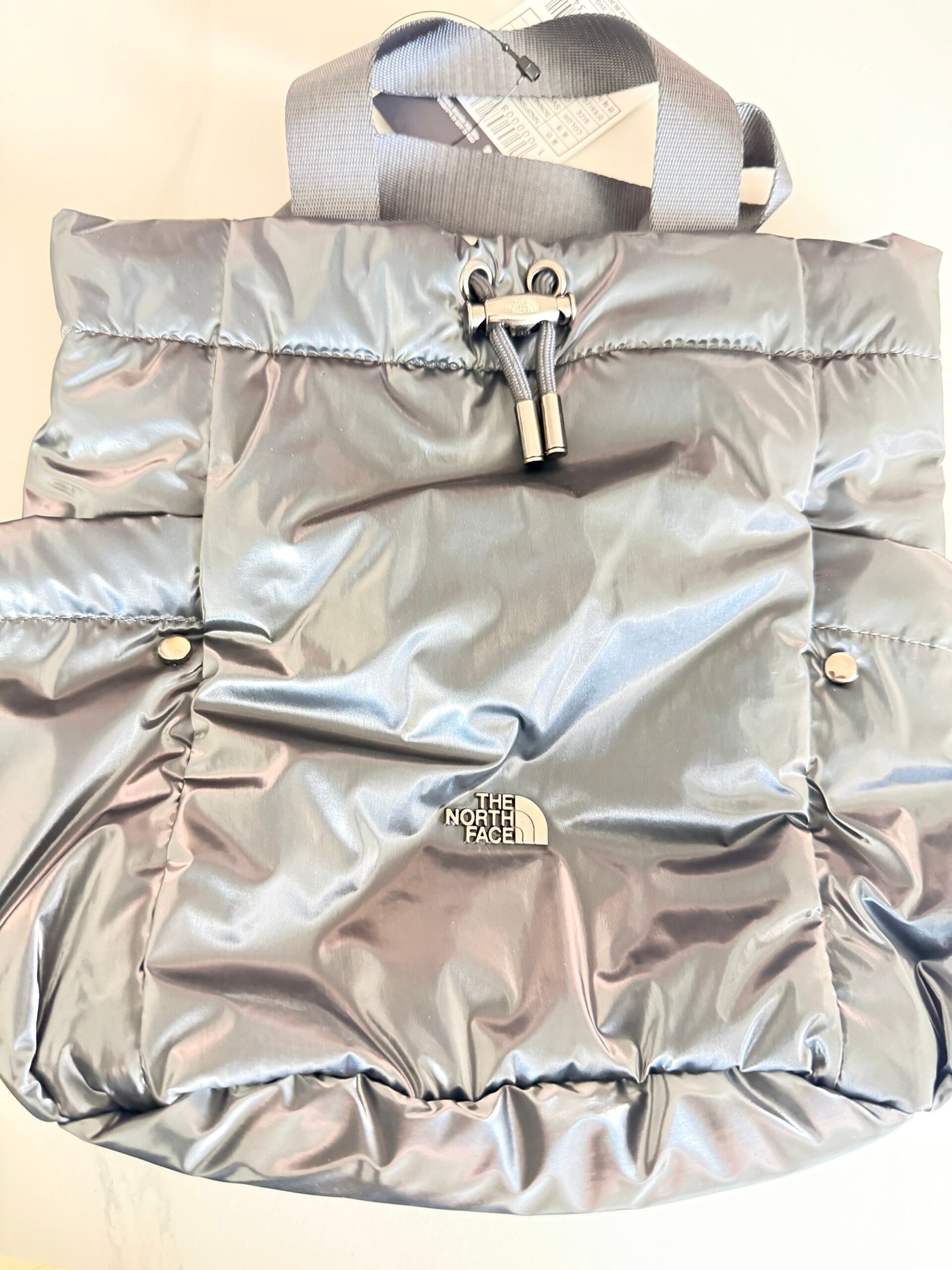 Silver-gray North Face Bonney Bucket Bag Mini NN2PS56K exterior with drawstring closure
