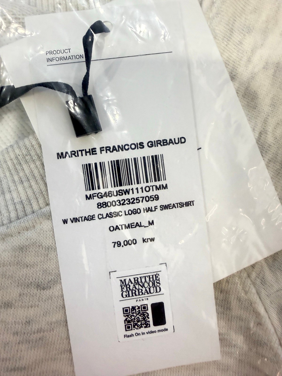 Marithé Korea MFG46USW111OTMM product tag showing oatmeal color and size M